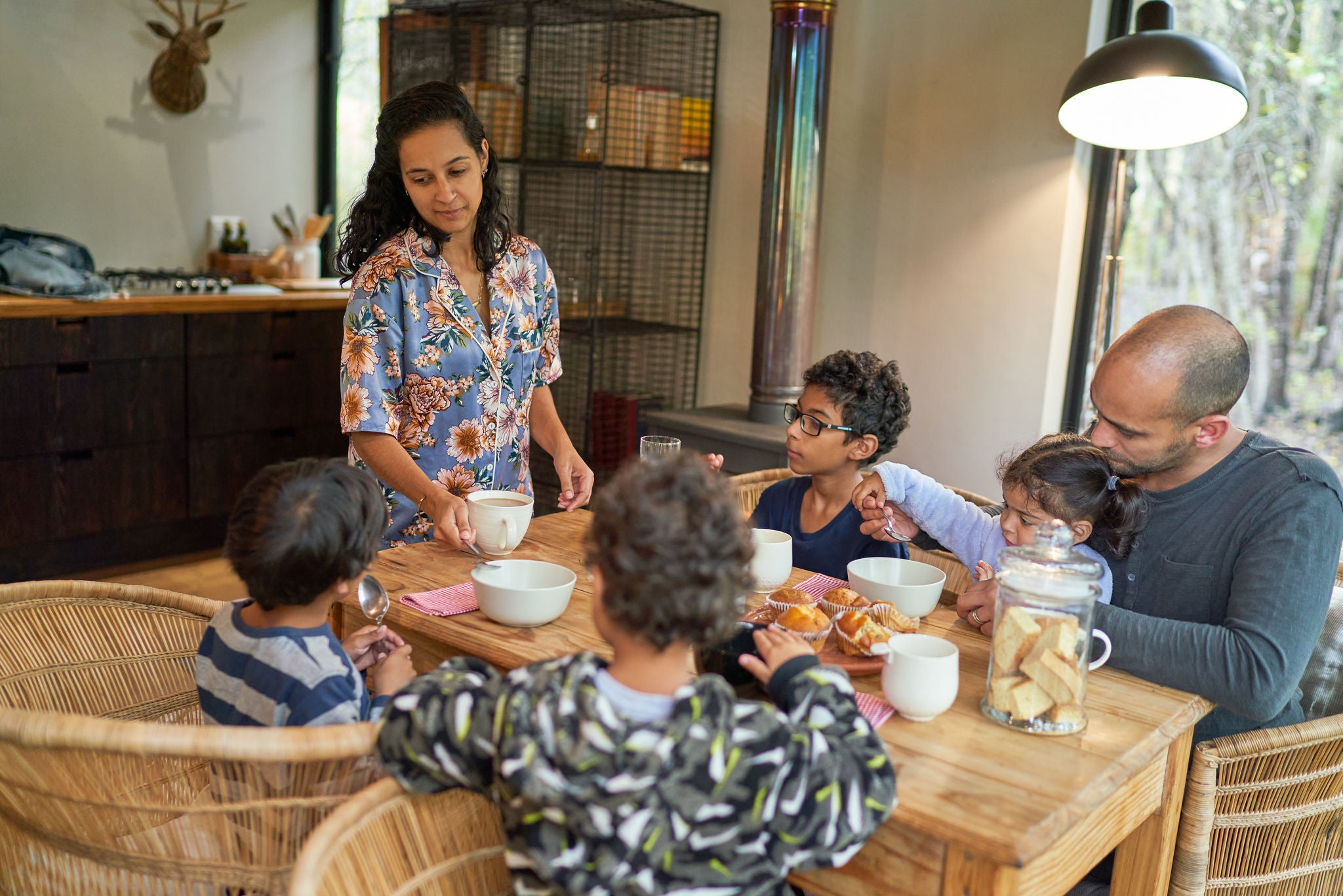 Family enjoying breakfast together at home dining table