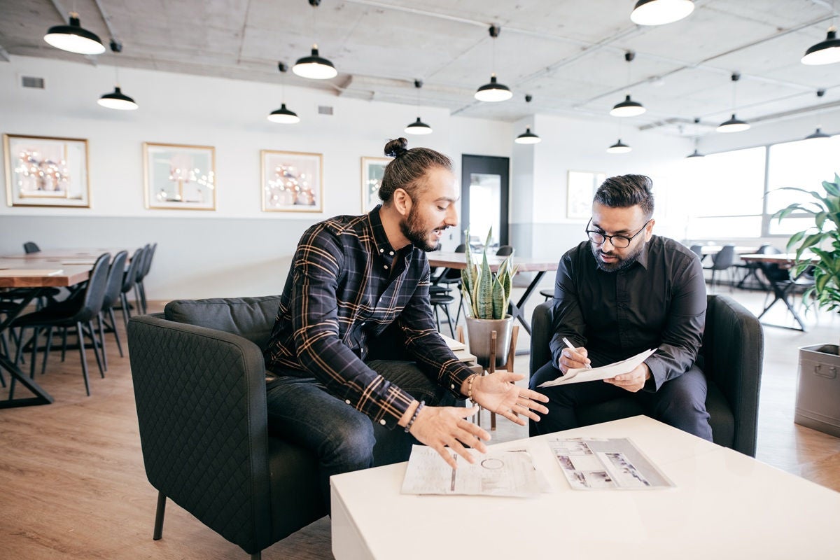 Business owner discussing plans with finanacial advisor