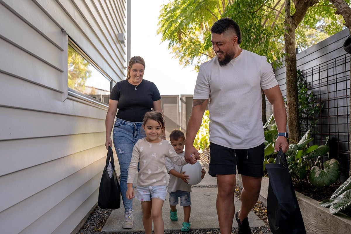 Family managing everyday spending and household finances during routine shopping